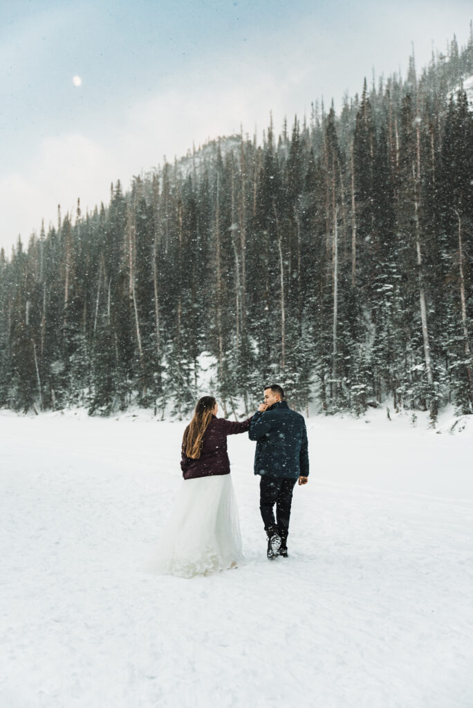 Eloping couple in the Colorado mountains in the winter